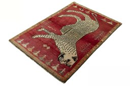Corner detail of 2000s Persian Gabbeh rug showing border pattern and Wool pile