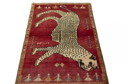 Surface texture of 2000s Persian Gabbeh rug with natural Wool and intricate pattern