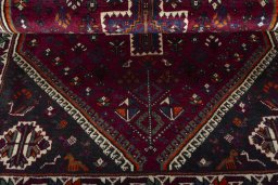 Corner detail of 2000s Persian Gabbeh rug showing border pattern and Wool pile