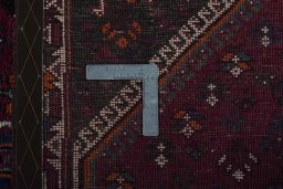 Surface texture of 2000s Persian Gabbeh rug with natural Wool and intricate pattern