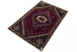 Corner detail of 2000s Persian Gabbeh rug showing border pattern and Wool pile