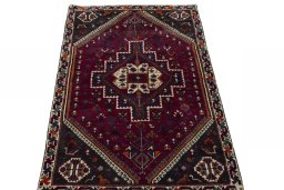 Surface texture of 2000s Persian Gabbeh rug with natural Wool and intricate pattern