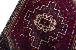 Backside of handmade 2000s Persian Gabbeh rug showing knot structure and weave density