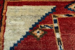 Surface texture of 1950s Persian Gabbeh rug with natural Wool and intricate pattern