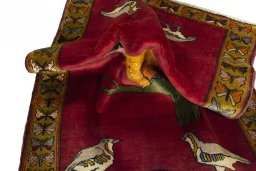 Corner detail of 2000s Persian Gabbeh rug showing border pattern and Wool pile