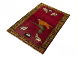 Corner detail of 2000s Persian Gabbeh rug showing border pattern and Wool pile