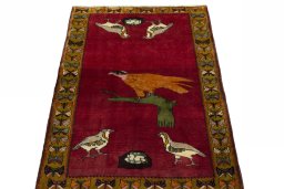 Surface texture of 2000s Persian Gabbeh rug with natural Wool and intricate pattern