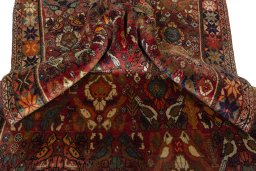 Corner detail of 2000s Persian Gabbeh rug showing border pattern and Wool pile