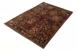 Corner detail of 2000s Persian Gabbeh rug showing border pattern and Wool pile