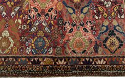 Central medallion detail of 2000s Persian Gabbeh rug from Iran / Persia