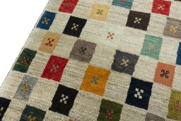 Backside of handmade New Persian Gabbeh rug showing knot structure and weave density