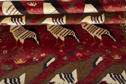 Full view of 1970s Persian Gabbeh rug from Iran / Persia, 186 × 123 cm in Red tones