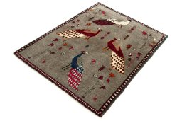 Corner detail of 2000s Persian Gabbeh rug showing border pattern and Wool pile