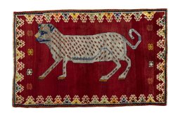 Full view of 2000s Persian Gabbeh rug from Iran / Persia, 188 × 122 cm in Red tones