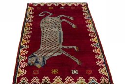 Surface texture of 2000s Persian Gabbeh rug with natural Wool and intricate pattern