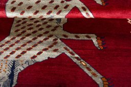 Full view of 2000s Persian Gabbeh rug from Iran / Persia, 188 × 122 cm in Red tones