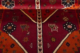Full view of 2000s Persian Gabbeh rug from Iran / Persia, 208 × 118 cm in Red tones