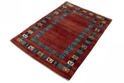 Corner detail of New Persian Gabbeh rug showing border pattern and Wool pile
