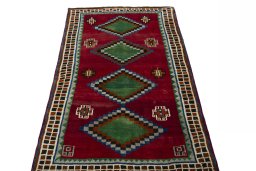 Surface texture of 2000s Persian Gabbeh rug with natural Wool and intricate pattern