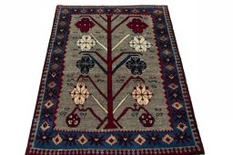 Surface texture of 2000s Persian Gabbeh rug with natural Wool and intricate pattern