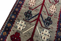 Backside of handmade 2000s Persian Gabbeh rug showing knot structure and weave density