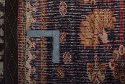 Surface texture of 2000s Persian Gabbeh rug with natural Wool and intricate pattern