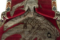 Corner detail of 2000s Persian Gabbeh rug showing border pattern and Wool pile