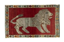 Full view of 2000s Persian Gabbeh rug from Iran / Persia, 182 × 112 cm in Red tones