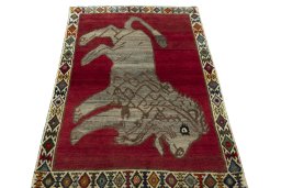 Surface texture of 2000s Persian Gabbeh rug with natural Wool and intricate pattern