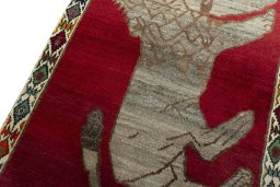 Backside of handmade 2000s Persian Gabbeh rug showing knot structure and weave density