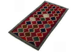 Corner detail of 2000s Persian Gabbeh rug showing border pattern and Wool pile