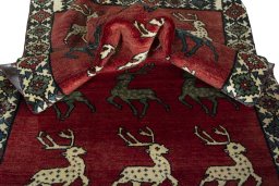 Corner detail of 2000s Persian Gabbeh rug showing border pattern and Wool pile