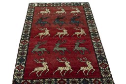 Surface texture of 2000s Persian Gabbeh rug with natural Wool and intricate pattern