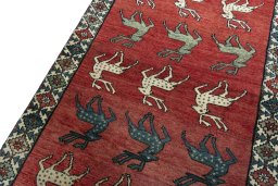 Backside of handmade 2000s Persian Gabbeh rug showing knot structure and weave density