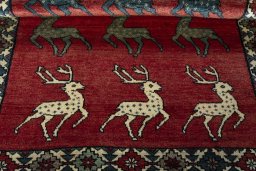 Full view of 2000s Persian Gabbeh rug from Iran / Persia, 203 × 133 cm in Red tones