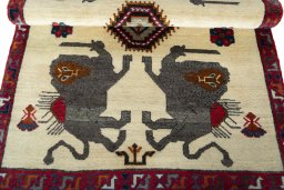 Corner detail of 2000s Persian Gabbeh rug showing border pattern and Wool pile