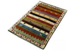 Corner detail of 2000s Persian Gabbeh rug showing border pattern and Wool pile