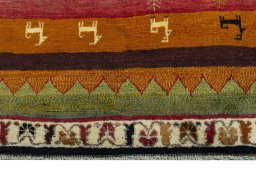 Backside of handmade 2000s Persian Gabbeh rug showing knot structure and weave density