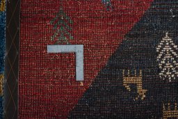 Close-up detail of 2000s Persian Gabbeh rug from Iran / Persia showing Wool weave
