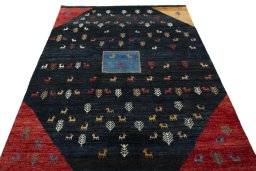 Surface texture of 2000s Persian Gabbeh rug with natural Wool and intricate pattern