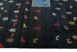 Close-up detail of 2000s Persian Gabbeh rug from Iran / Persia showing Wool weave
