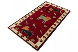 Corner detail of 2000s Persian Gabbeh rug showing border pattern and Wool pile