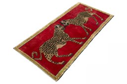Corner detail of 2000s Persian Gabbeh rug showing border pattern and Wool pile