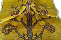 Corner detail of 2000s Persian Gabbeh rug showing border pattern and Wool pile