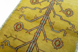 Backside of handmade 2000s Persian Gabbeh rug showing knot structure and weave density