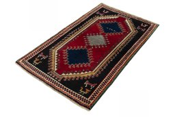 Corner detail of 2000s Persian Gabbeh rug showing border pattern and Wool pile