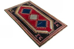 Close-up detail of 2000s Persian Gabbeh rug from Iran / Persia showing Wool weave