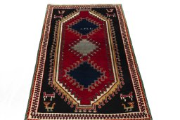 Surface texture of 2000s Persian Gabbeh rug with natural Wool and intricate pattern