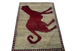 Surface texture of 2000s Persian Gabbeh rug with natural Wool and intricate pattern