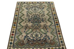 Surface texture of 2000s Persian Gabbeh rug with natural Wool and intricate pattern